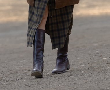 Zoe Macon's brown knee-high leather boots